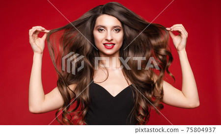 Gorgeous young brunette with ideal long hair on 75804937