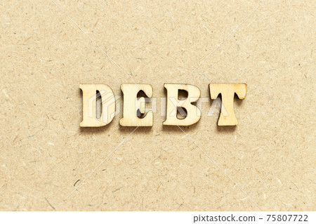 Alphabet letter in word debt on wood background Alphabet letter in word debt on wood background 75807722