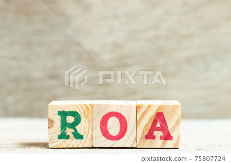 Alphabet letter in word ROA (Abbbreviation of Return on assets) on wood background Alphabet letter in word ROA (Abbbreviation of Return on assets) on wood background 75807724