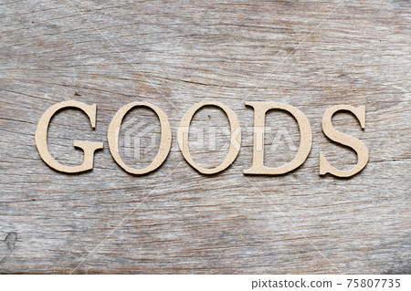 Alphabet letter in word goods on wood background Alphabet letter in word goods on wood background 75807735