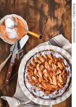 Homemade delicious apple pie, top view, wooden backdrop 75807858