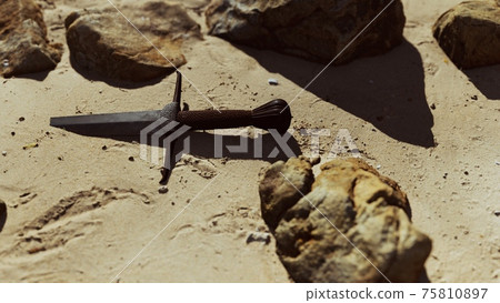 retro sword on sand beach 75810897