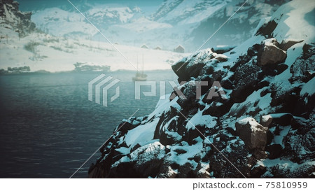 snow covered mountains in northern ocean 75810959