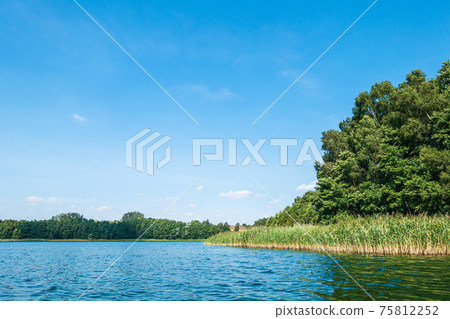 Landscape on a lake in Potzlow, Germany Landscape on a lake in Potzlow, Germany 75812252