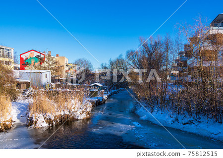 Backwater of the river Warnow in the city Rostock, Germany Backwater of the river Warnow in the city Rostock, Germany 75812515