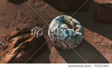 Old leather soccer ball abandoned on sand Old leather soccer ball abandoned on sand 75812901