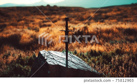 famous sword excalibur of King Arthur in the rock 75812903