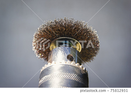 Steel nozzle brush drill on a gray background Steel nozzle brush drill on a gray background 75812931