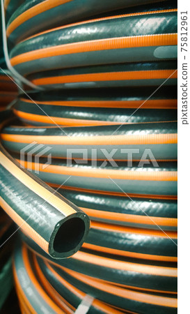 Close-up grey and orange garden water hose 75812961