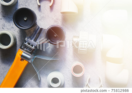 Fittings for polypropylene pipes and tools for working with plastic plumbing, heating systems and water supply. Top view Fittings for polypropylene pipes and tools for working with plastic plumbing, heating systems and water supply. Top view 75812986