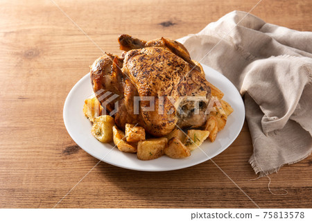 Homemade roasted chicken with potatoes Homemade roasted chicken with potatoes 75813578