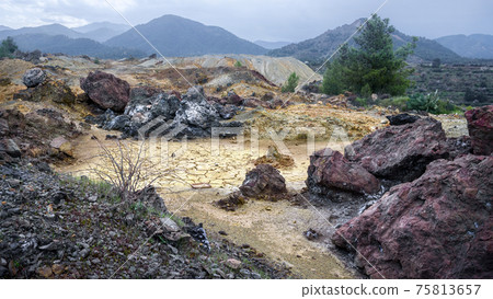 Piles of waste rocks and tailings near abandoned Memi mine in Xyliatos, Cyprus 75813657