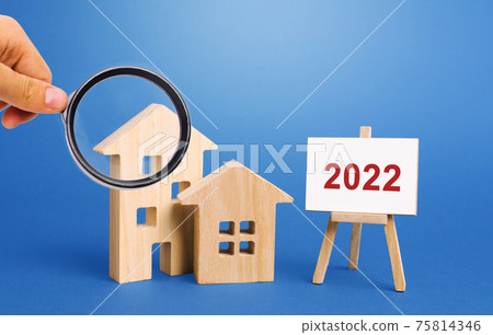 Inscription 2022 and miniature houses. Real estate concept. Family budget planning. Investments, plans, savings. Mortgage and mortgage rates. Forecasts. Loan. Refinance home Inscription 2022 and miniature houses. Real estate concept. Family budget planning. Investments, plans, savings. Mortgage and mortgage rates. Forecasts. Loan. Refinance home 75814346