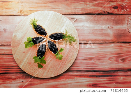 Tartlets with black caviar 75814465