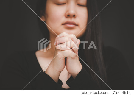 woman praying and worship to GOD Using hands to pray in religious beliefs and worship christian in the church or in general locations in vintage color tone or copy space. woman praying and worship to GOD Using hands to pray in religious beliefs and worship christian in the church or in general locations in vintage color tone or copy space. 75814614