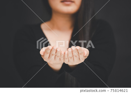 woman praying and worship to GOD Using hands to pray in religious beliefs and worship christian in the church or in general locations in vintage color tone or copy space. woman praying and worship to GOD Using hands to pray in religious beliefs and worship christian in the church or in general locations in vintage color tone or copy space. 75814621