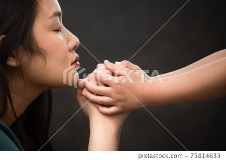 Woman's hand and Children are praying and worship to GOD Using hands to pray in religious beliefs and worship christian in the church or in general locations in vintage color tone or copy space. Woman's hand and Children are praying and worship to GOD Using hands to pray in religious beliefs and worship christian in the church or in general locations in vintage color tone or copy space. 75814633