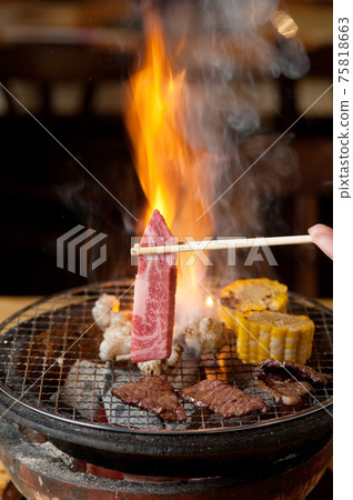 Roasted meat and flame 75818663