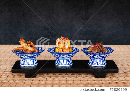 Thai fried snack fried tofu fried pork in ceramic bowls 75820399