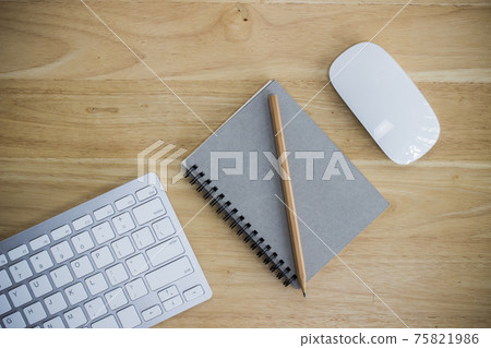 Workplace with notebook and keyboard, mouse on wooden table Workplace with notebook and keyboard, mouse on wooden table 75821986