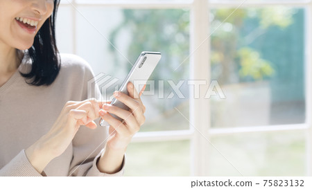 middle woman using smartphone middle woman using smartphone 75823132