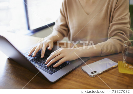 Woman doing work at home 75827082