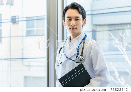 Young doctor working in a hospital Young doctor working in a hospital 75828342