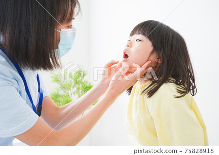 Little girl getting treatment from a dentist Little girl getting treatment from a dentist 75828918