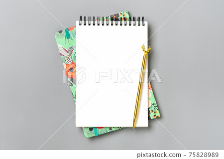 open notepad, golden pen on gray background, spiral notebook on table Business, planning, education, morning life working from home concept Top view Flat lay Mock up open notepad, golden pen on gray background, spiral notebook on table Business, planning, education, morning life working from home concept Top view Flat lay Mock up 75828989