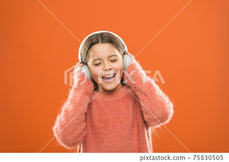 Enjoy sound. Girl cute little child wear headphones listen Enjoy sound. Girl cute little child wear headphones listen 75830505