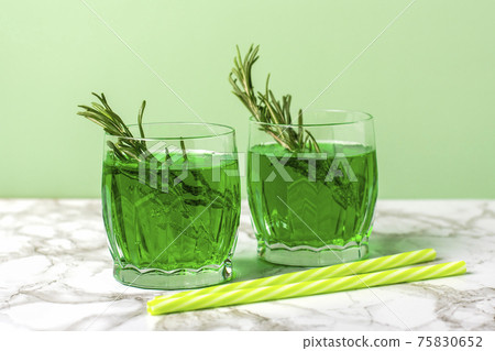 Tarhun is sweet, non-alcoholic carbonated soft lemonade drink of emerald green color It is made from water, citric acid, sugar and extract of tarragon (plant also known as tarhun) Tarhun is sweet, non-alcoholic carbonated soft lemonade drink of emerald green color It is made from water, citric acid, sugar and extract of tarragon (plant also known as tarhun) 75830652
