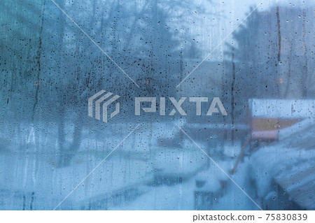 Dirty scratched glass with dew drops 75830839