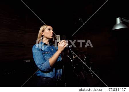 Play on. Gorgeous good-looking female vocal artist singing in th Play on. Gorgeous good-looking female vocal artist singing in th 75831437