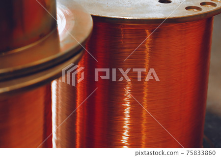 Copper wire reels in cable factory close up 75833860