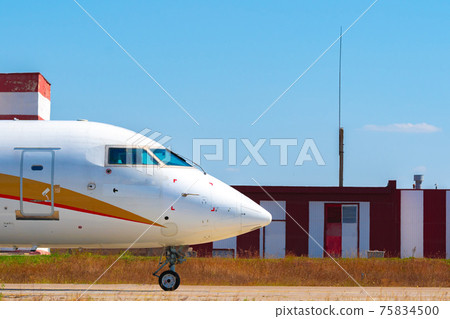 Cockpit of big passenger airliner on runway close up 75834500