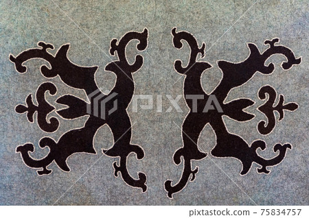 National Balkar pattern made with black thread on gray woolen fabric National Balkar pattern made with black thread on gray woolen fabric 75834757