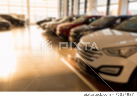 New cars at sunlit dealer showroom close view 75834987