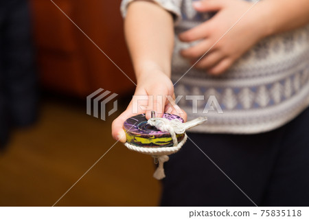 Children's hands turning pieces 75835118
