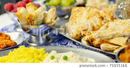Chicken jalfrezi and chicken curry with various rice and onion Bhajis and Samosas Chicken jalfrezi and chicken curry with various rice and onion Bhajis and Samosas 75835168