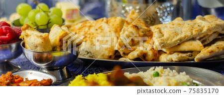 Chicken jalfrezi and chicken curry with various rice and onion Bhajis and Samosas Chicken jalfrezi and chicken curry with various rice and onion Bhajis and Samosas 75835170