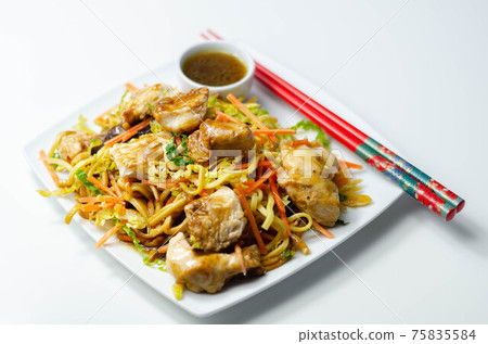 Cooked chicken breast pieces with savory garlic and ginger soy sauce and  noodles, black fungus mushrooms, savoy cabbage, and carrot 75835584