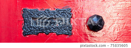 Old letterbox in the door, traditional way of delivering letters to the house, old mailbox Old letterbox in the door, traditional way of delivering letters to the house, old mailbox 75835605