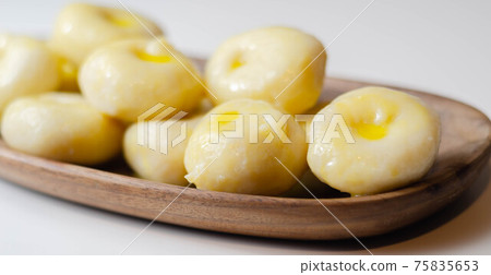 Traditional Silesian dumplings with a hole,  homemade noodles served with butter 75835653