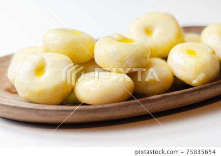 Traditional Silesian dumplings with a hole, homemade noodles served with butter Traditional Silesian dumplings with a hole, homemade noodles served with butter 75835654