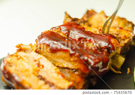 Pork ribs in a smoky flavour barbecue seasoning with a honey barbecue sauce Pork ribs in a smoky flavour barbecue seasoning with a honey barbecue sauce 75835670