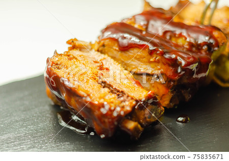 Pork ribs in a smoky flavour barbecue seasoning with a honey barbecue sauce Pork ribs in a smoky flavour barbecue seasoning with a honey barbecue sauce 75835671