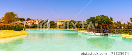 A beautiful place in a city park with water and moored white boats, a perfect place for a romantic time for couples and honeymooners A beautiful place in a city park with water and moored white boats, a perfect place for a romantic time for couples and honeymooners 75835674