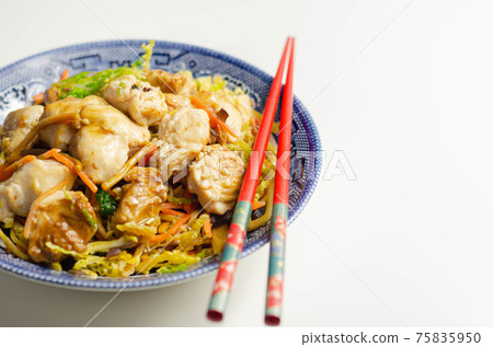 Cooked chicken breast pieces with savory garlic and ginger soy sauce and  noodles, black fungus mushrooms, savoy cabbage, and carrot 75835950