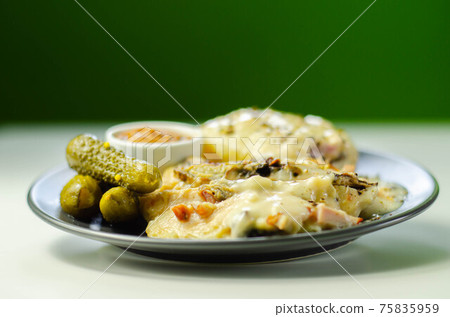 Chicken breast with sliced mushrooms, ham, in cheese sauce with mash potato, pickled red cabbage, and gherkin Chicken breast with sliced mushrooms, ham, in cheese sauce with mash potato, pickled red cabbage, and gherkin 75835959