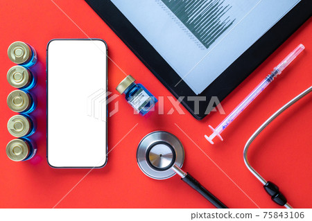 Cellphone mockup. Syringe with needle, hospital healthcare charts, doctor stethoscope and black smartphone with blank screen for medical equipment background with clipping path, copy space. Cellphone mockup. Syringe with needle, hospital healthcare charts, doctor stethoscope and black smartphone with blank screen for medical equipment background with clipping path, copy space. 75843106